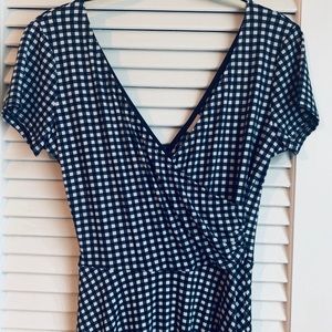 Navy plaid, wrap style, tea-length dress.